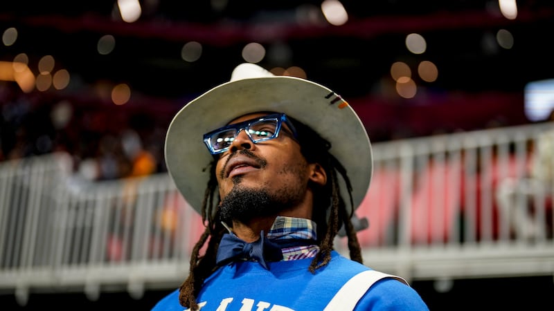 NFL football player Cam Newton watches play between Howard and Florida A&M during the first...