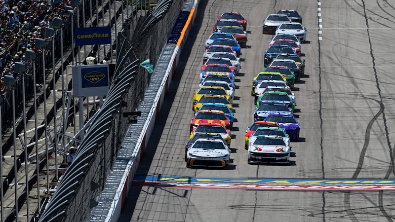 Tyler Reddick (45) leads a pack of cars to the green flag during a NASCAR Cup Series auto race...