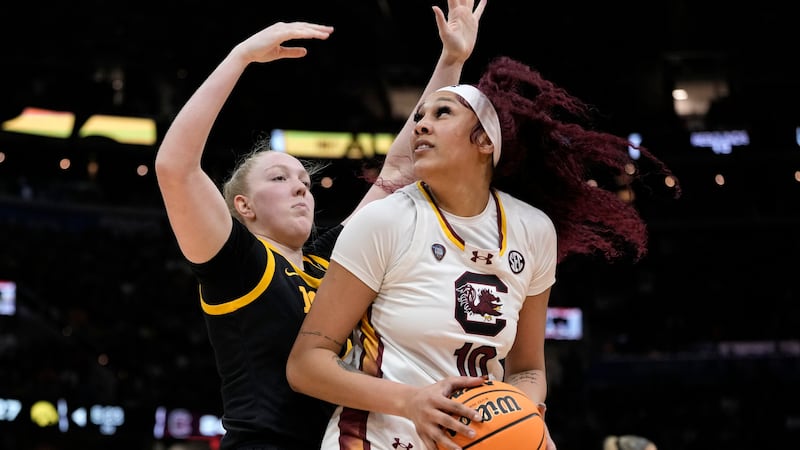 South Carolina center Kamilla Cardoso (10) drives around Iowa forward Addison O'Grady during...