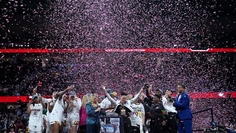 South Carolina players and coaches celebrate after the Final Four college basketball...