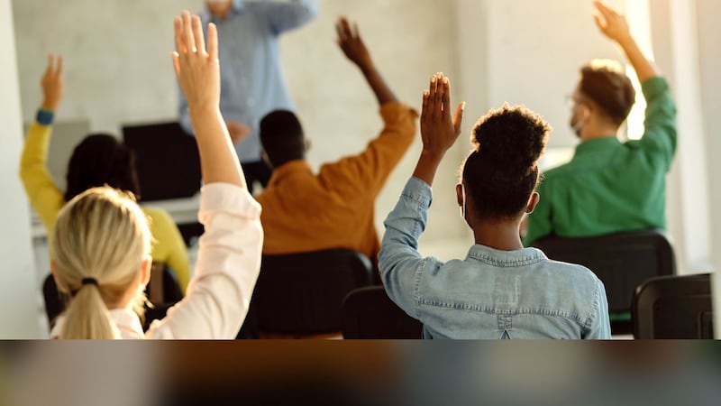 Teacher with mask, students