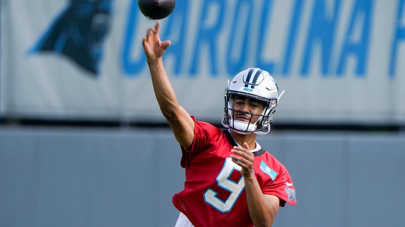 Carolina Panthers quarterback Bryce Young (9) throws a pass during NFL football practice,...