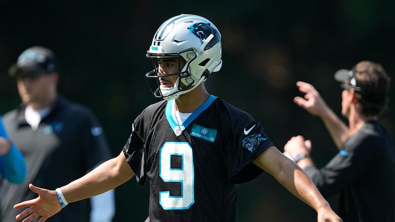 Carolina Panthers quarterback Bryce Young watches drills at the NFL football team's training...