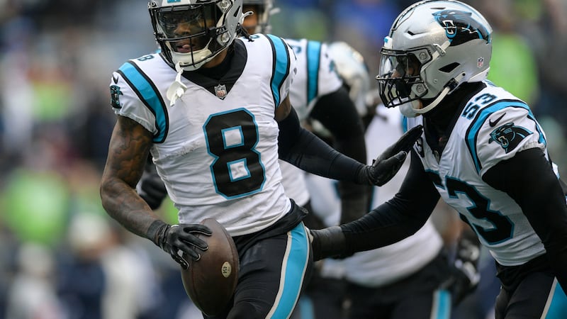 Carolina Panthers cornerback Jaycee Horn (8) celebrates his touchdown against the Seattle...