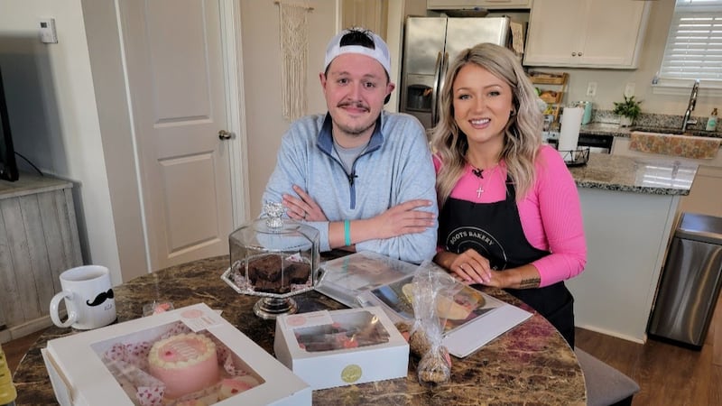 Patrick and Nichole Harasyn pose in their kitchen that transforms into their at home bakery.