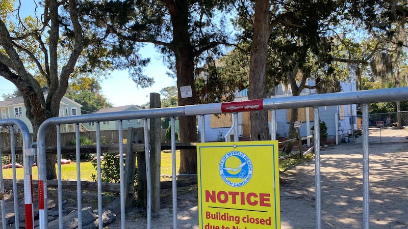 Myrtle Beach police put up barricades and boarded up the windows at the Yellow House along 5th...