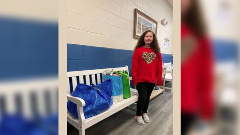 Peyton McDaniel brought in 100 food items for donation to the Helping Hands Food Bank for the...