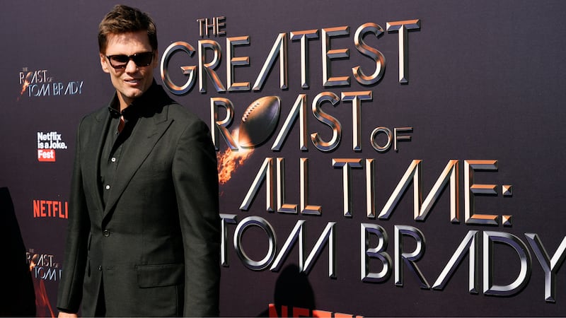 FILE -- Tom Brady poses at "The Greatest Roast of All Time: Tom Brady" at the Kia Forum,...