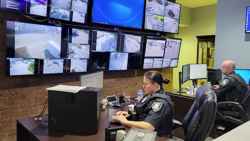 Officers watching city cameras from inside the Real Time Crime Unit.