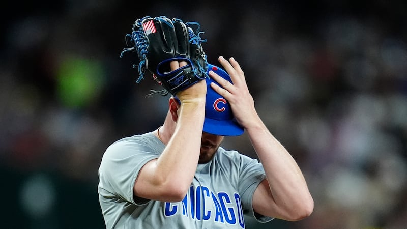 Chicago Cubs relief pitcher Luke Little pauses on the mound during the fifth inning of the...