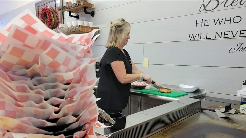 Restaurant owner makes sandwich at Ole Fashioned Sandwich Shoppe in Mullins, S.C.