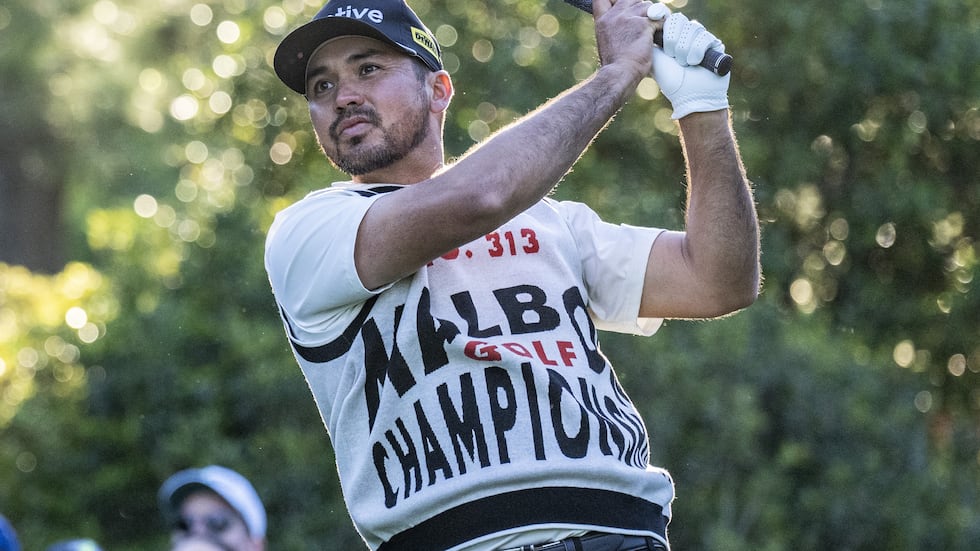 Jason Day of Australia plays a stroke from the No. 15 tee during the continuation of the first...