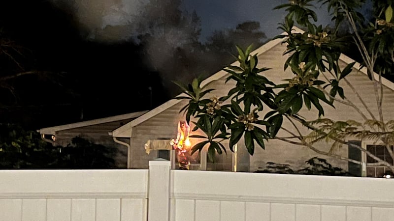 Records show one of the two people accused of burning a cross to scare their Black neighbors...