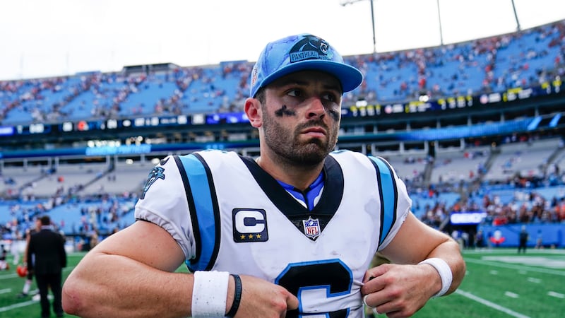 Carolina Panthers quarterback Baker Mayfield leaves the field after their loss against the...